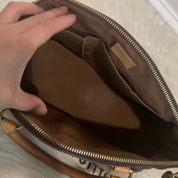 Louis Vuitton Monogram Tivoli leather hand bag - Picture 12 of 16